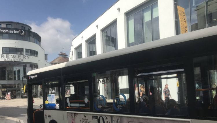 Image showing a bus at a bus stop in city center