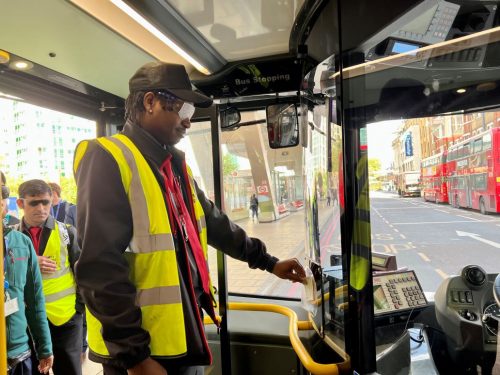 Bus driver in sim specs tapping in at London Meet The Bus event